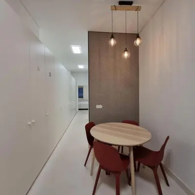 a dining room with a table and chairs in a room at Neo Porto Family & Friends in Porto