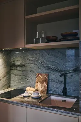 a kitchen with a sink and a counter top at Prim&Proper in Porto
