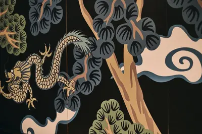 a painting of a dragon on a wall at Prim&Proper in Porto