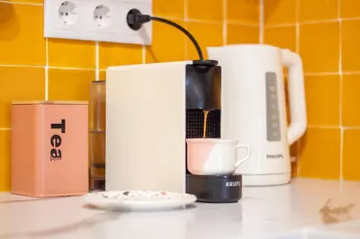 a coffee maker and a cup on a counter at Campinho 1T - Stylish 1BR by LovelyStay in Porto