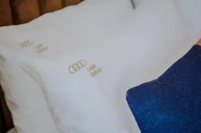 a white pillow with price tags on it at Login Luxury Apartment in Porto
