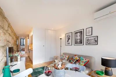 a living room with a table and a couch at Fontainhas Elite Apartments in Porto