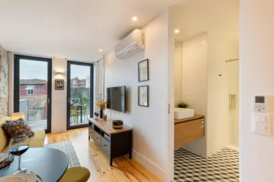 a bathroom with a sink and a toilet in a room at Fontainhas Elite Apartments in Porto