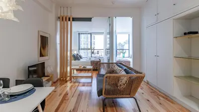 a living room with a couch and a table at Fernandes Tomás 424 by LovelyStay in Porto