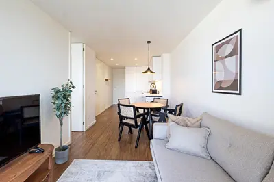 a living room with a couch and a table at Santos Pousada 1071 by LovelyStay in Porto