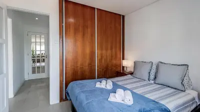 a living room and kitchen with a couch and a table at Central Gaia Apartment by Unique Hosts in Vila Nova de Gaia